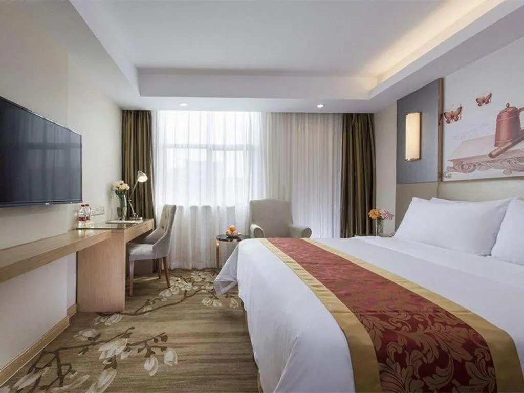 Bed in Vienna Hotel Shenzhen Guanlan Shanshuitianyuan Xintian