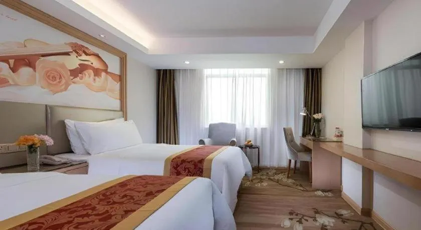 Bed in Vienna Hotel Shenzhen Guanlan Shanshuitianyuan Xintian