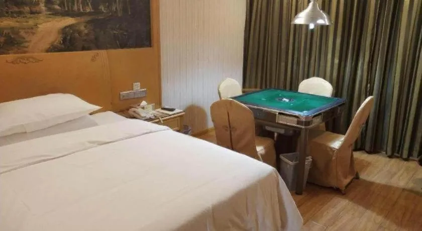 Bed in Vienna Hotel Shenzhen Guanlan Shanshuitianyuan Xintian