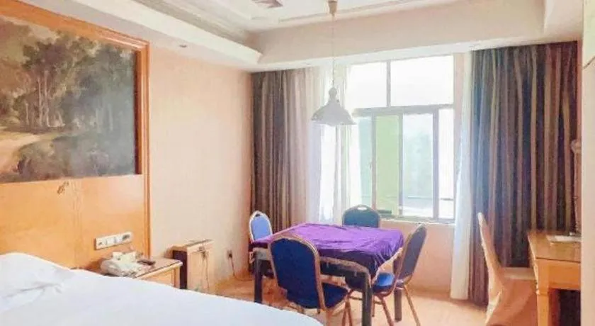 Bed in Vienna Hotel Shenzhen Guanlan Shanshuitianyuan Xintian