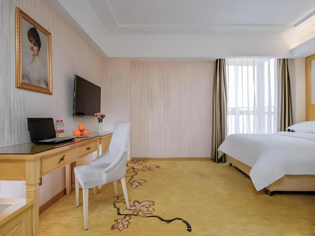 Bed in Vienna Hotel Wuhan Huazhong Normal University Huquan Metro Station