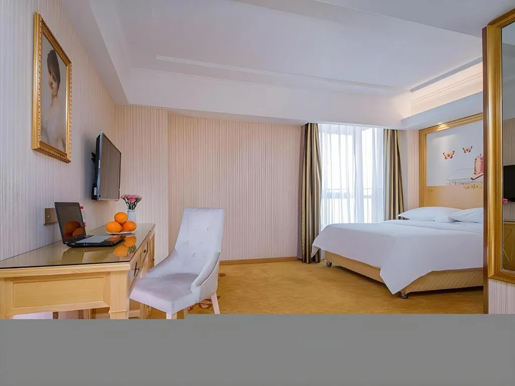 Bed in Vienna Hotel Wuhan Huazhong Normal University Huquan Metro Station