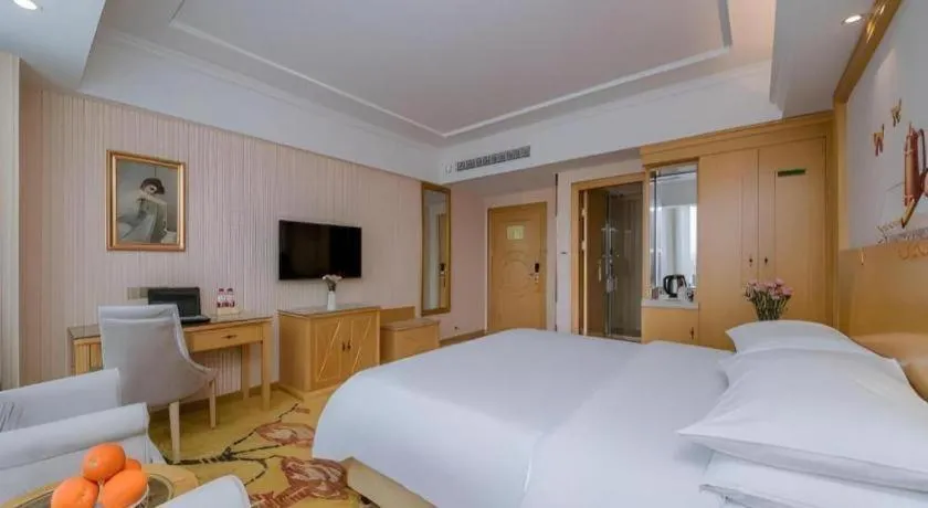 Bed in Vienna Hotel Wuhan Huazhong Normal University Huquan Metro Station