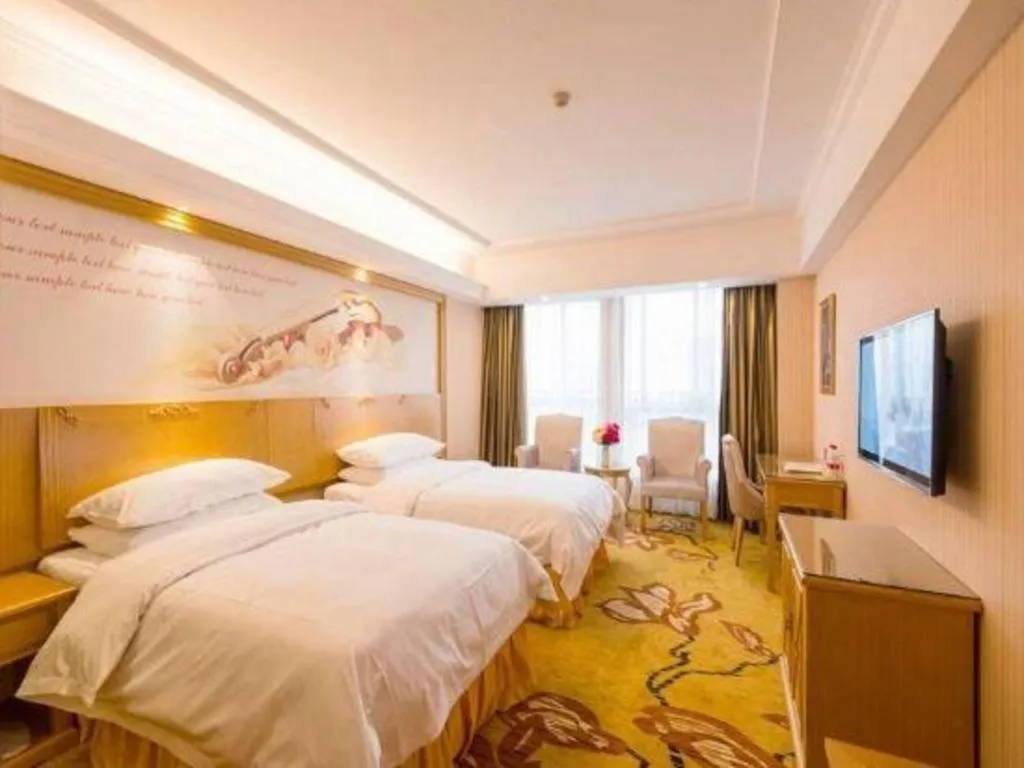 Bed in Vienna Hotel Wuhan Huazhong Normal University Huquan Metro Station