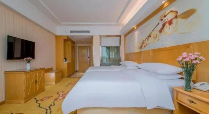 Bed in Vienna Hotel Wuhan Huazhong Normal University Huquan Metro Station