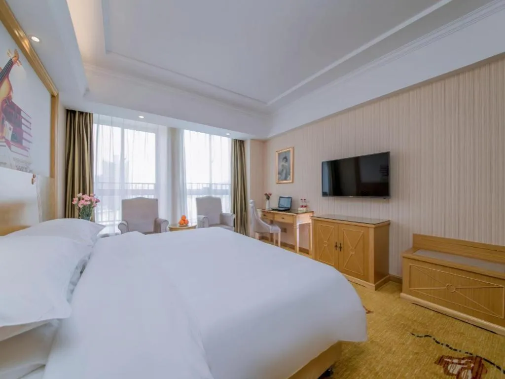 Bed in Vienna Hotel Wuhan Huazhong Normal University Huquan Metro Station