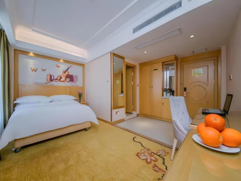 Bed in Vienna Hotel Wuhan Huazhong Normal University Huquan Metro Station