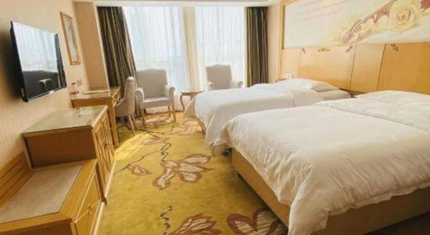 Bed in Vienna Hotel Wuhan Huazhong Normal University Huquan Metro Station