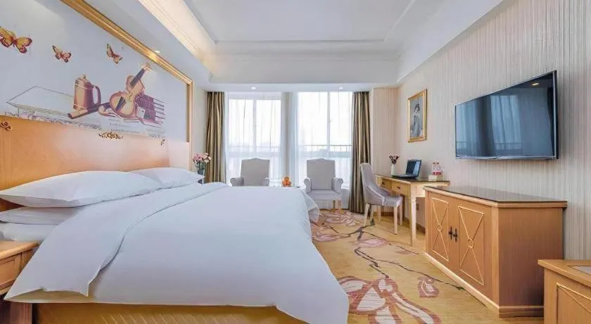 Bed in Vienna Hotel Wuhan Huazhong Normal University Huquan Metro Station