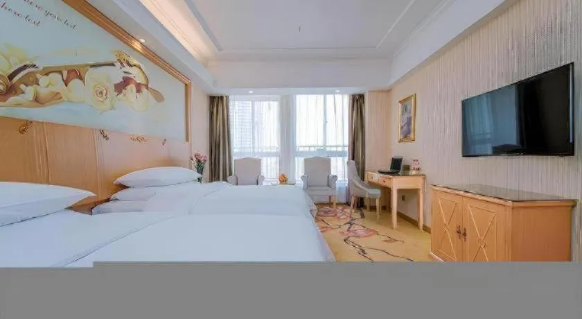 Bed in Vienna Hotel Wuhan Huazhong Normal University Huquan Metro Station