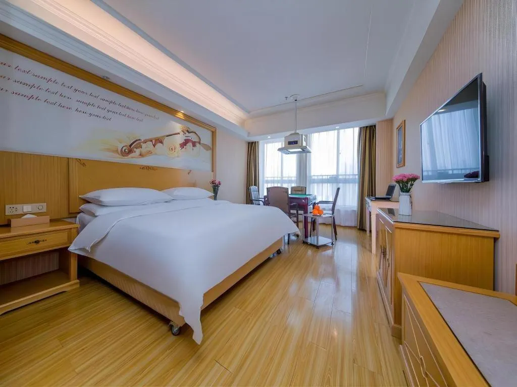 Bed in Vienna Hotel Wuhan Huazhong Normal University Huquan Metro Station