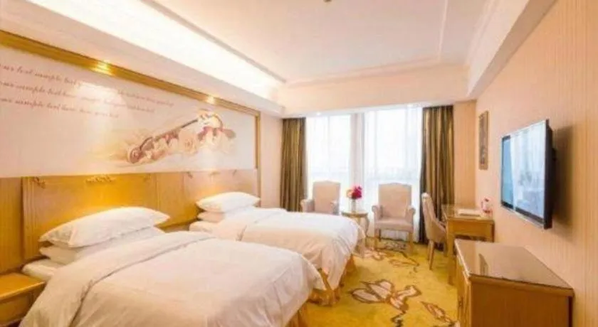 Bed in Vienna Hotel Wuhan Huazhong Normal University Huquan Metro Station