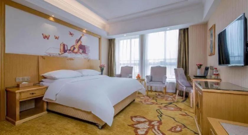 Bed in Vienna Hotel Wuhan Huazhong Normal University Huquan Metro Station