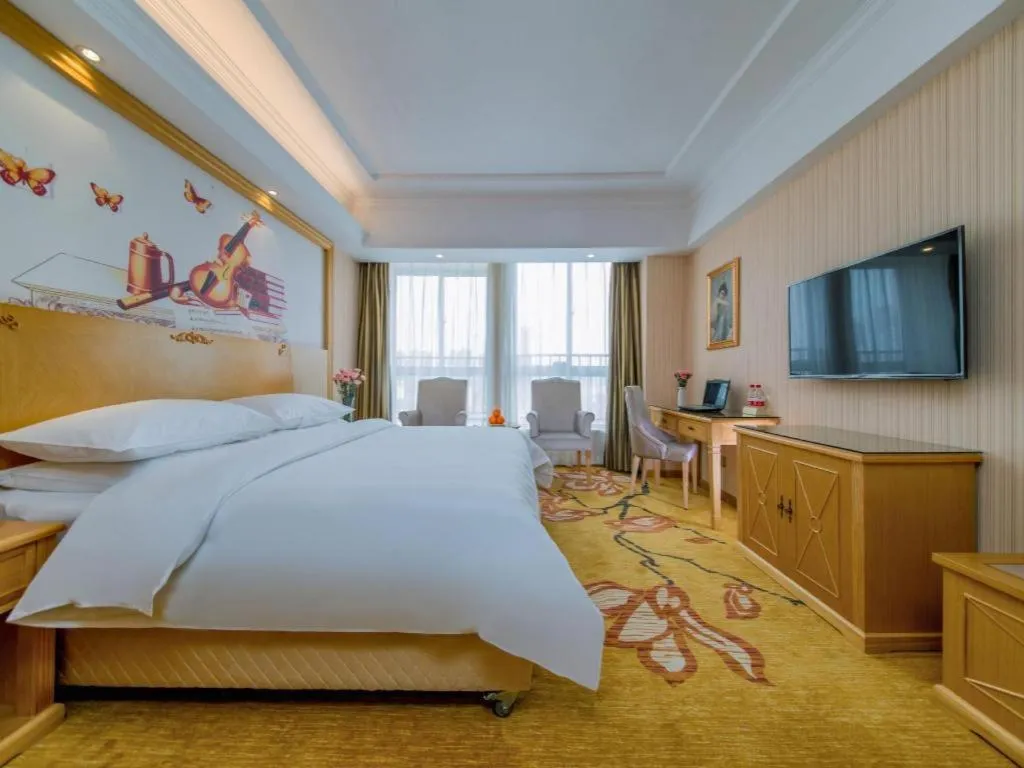 Bed in Vienna Hotel Wuhan Huazhong Normal University Huquan Metro Station