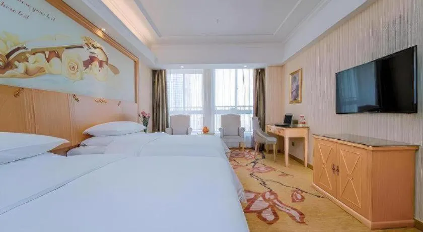 Bed in Vienna Hotel Wuhan Huazhong Normal University Huquan Metro Station