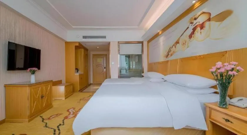 Bed in Vienna Hotel Wuhan Huazhong Normal University Huquan Metro Station