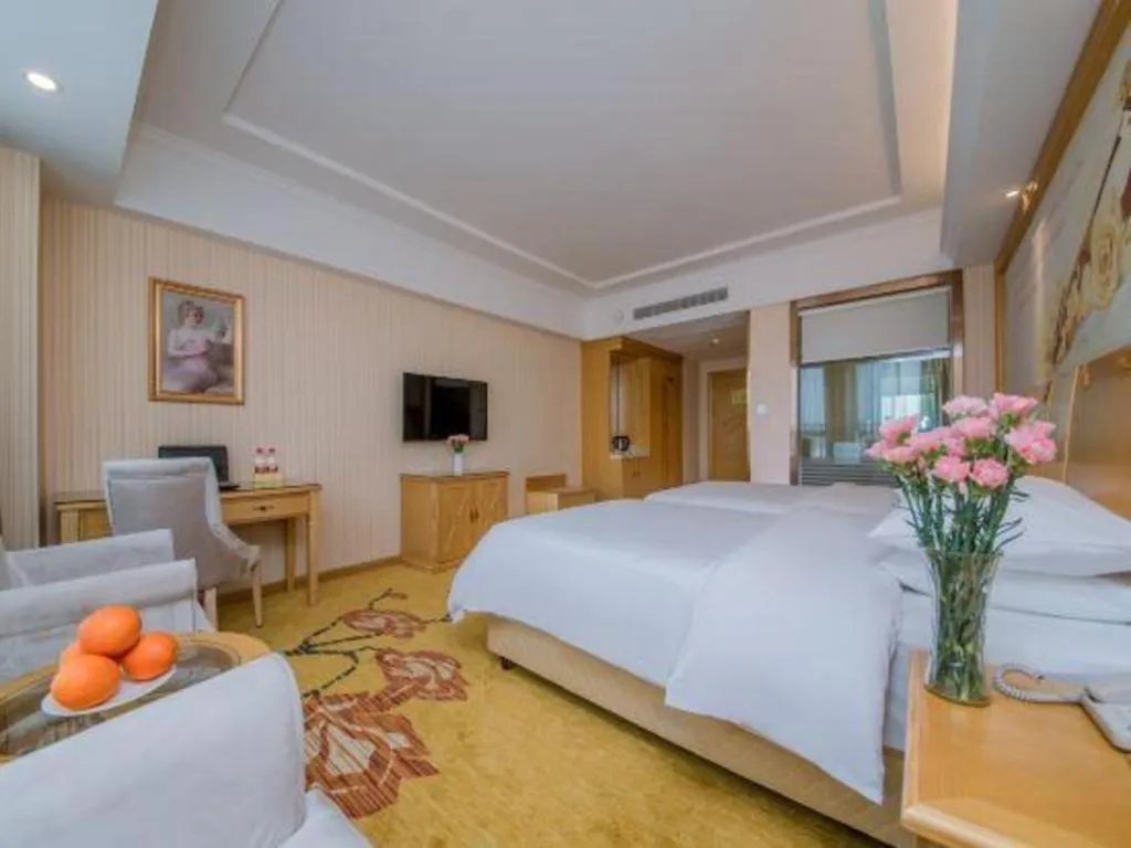 Bed in Vienna Hotel Wuhan Huazhong Normal University Huquan Metro Station