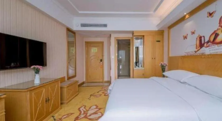 Bed in Vienna Hotel Wuhan Huazhong Normal University Huquan Metro Station