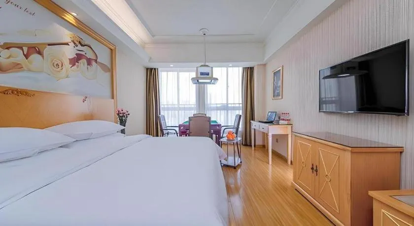 Bed in Vienna Hotel Wuhan Huazhong Normal University Huquan Metro Station