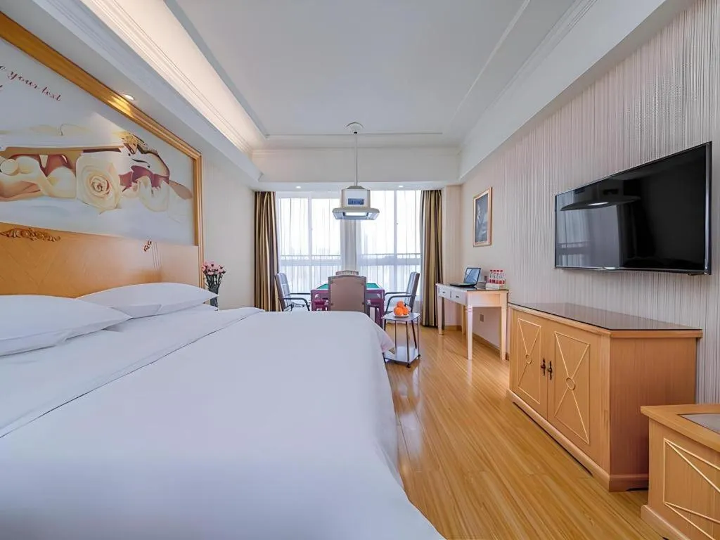 Bed in Vienna Hotel Wuhan Huazhong Normal University Huquan Metro Station