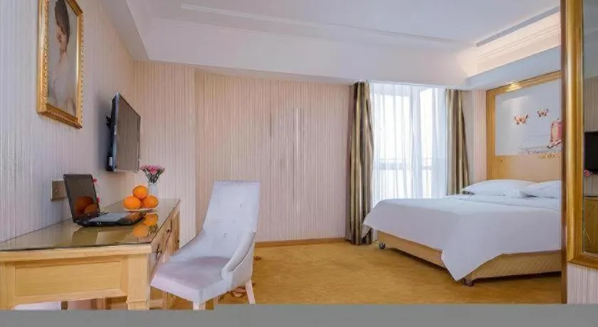 Bed in Vienna Hotel Wuhan Huazhong Normal University Huquan Metro Station