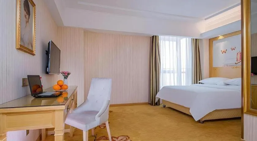 Bed in Vienna Hotel Wuhan Huazhong Normal University Huquan Metro Station