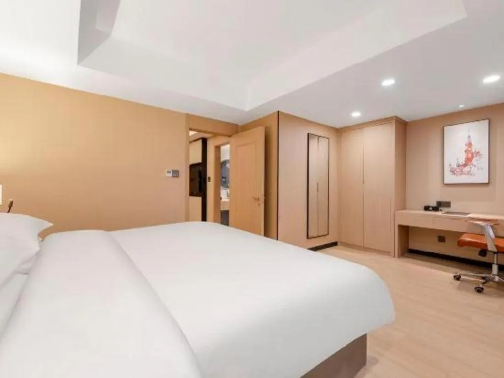 Bed in Vienna Hotel Shandong Jinan High-Tech Wanda Exhibition Center