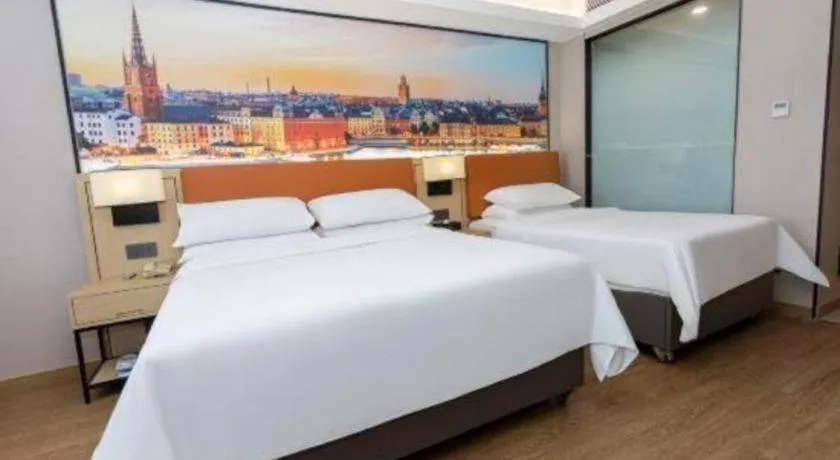 Bed in Vienna Hotel Shandong Jinan High-Tech Wanda Exhibition Center
