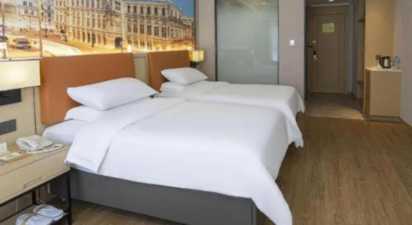 Bed in Vienna Hotel Shandong Jinan High-Tech Wanda Exhibition Center