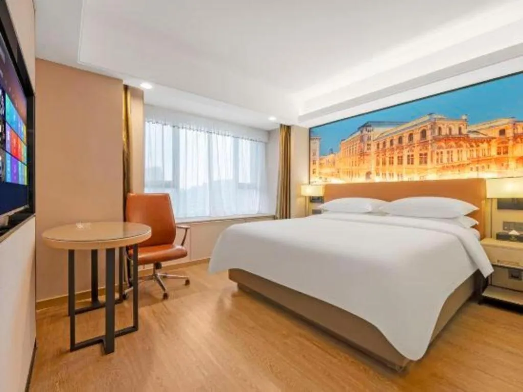 Bed in Vienna Hotel Shandong Jinan High-Tech Wanda Exhibition Center
