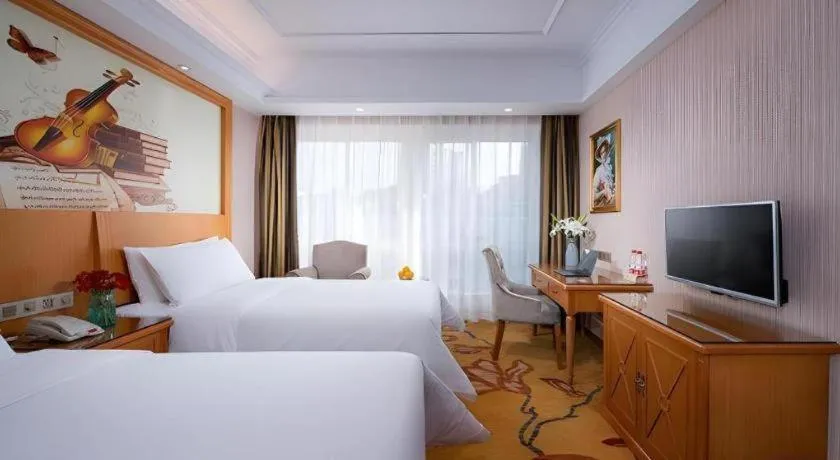Bed in Vienna Hotel Zhejiang Ningbo Beilun In Time City