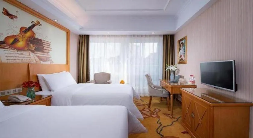 Bed in Vienna Hotel Zhejiang Ningbo Beilun In Time City