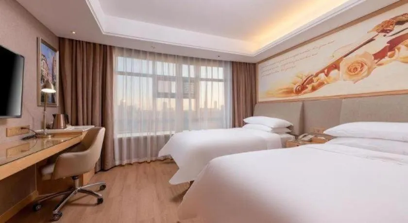 Bed in Vienna Hotel Tianjin Olympic Sports Center Tianta