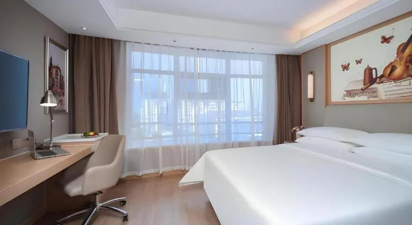 Bed in Vienna Hotel Tianjin Olympic Sports Center Tianta