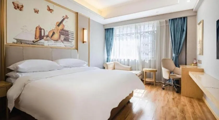 Bed in Vienna Hotel Kunming Baiyun Road Metro Station Jiang'an