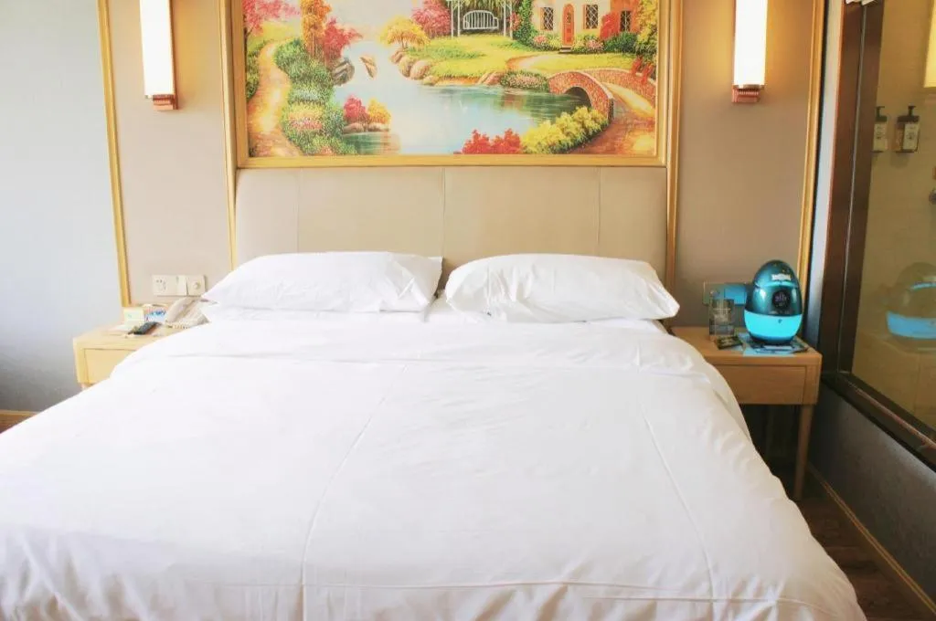 Bed in Vienna Hotel Kunming Baiyun Road Metro Station Jiang'an