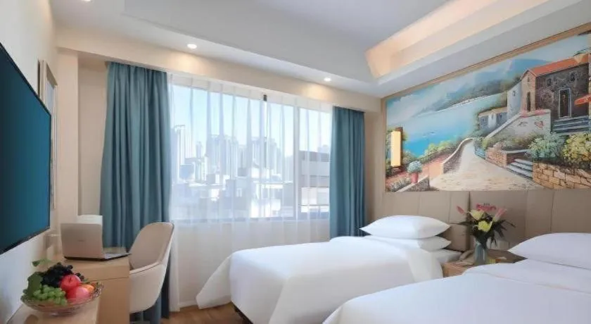 Bed in Vienna Hotel Kunming Baiyun Road Metro Station Jiang'an
