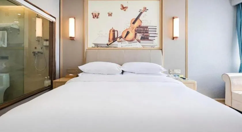 Bed in Vienna Hotel Kunming Baiyun Road Metro Station Jiang'an