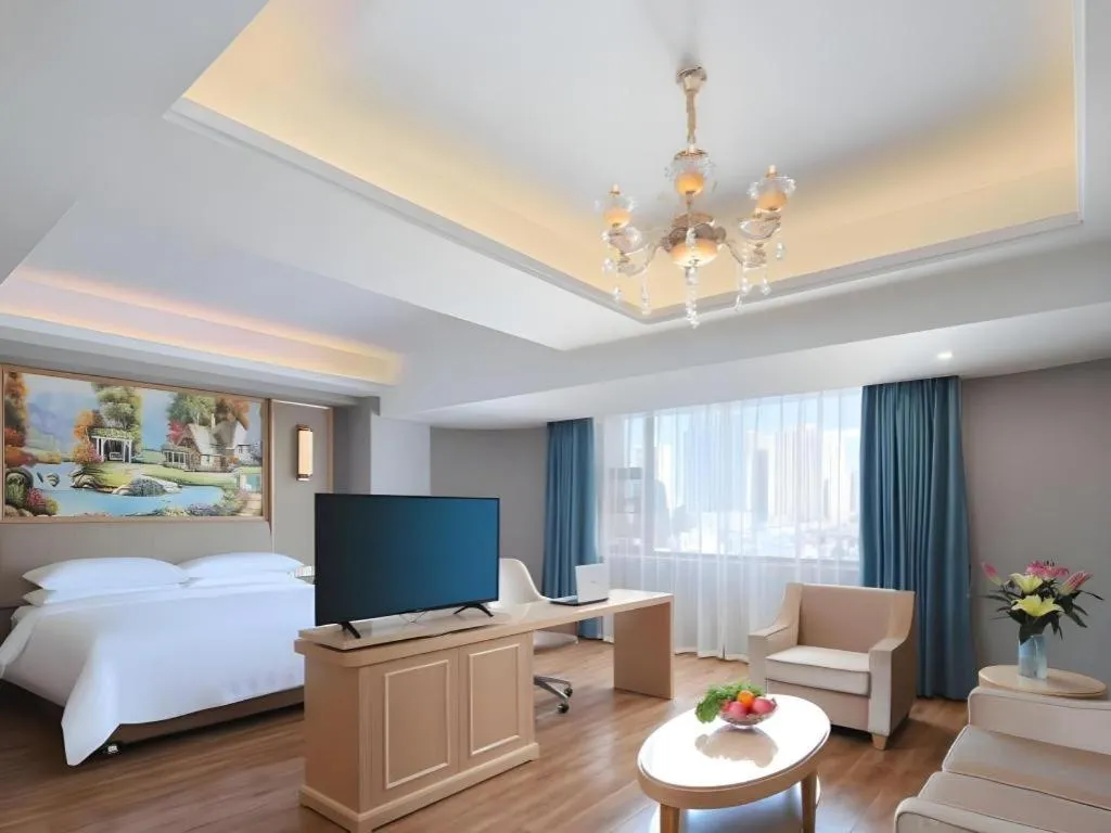 Bed in Vienna Hotel Kunming Baiyun Road Metro Station Jiang'an