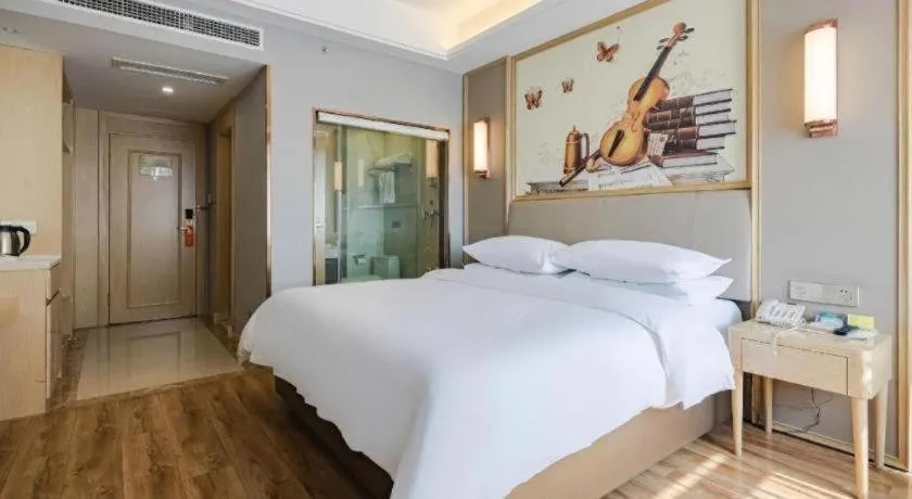 Bed in Vienna Hotel Kunming Baiyun Road Metro Station Jiang'an