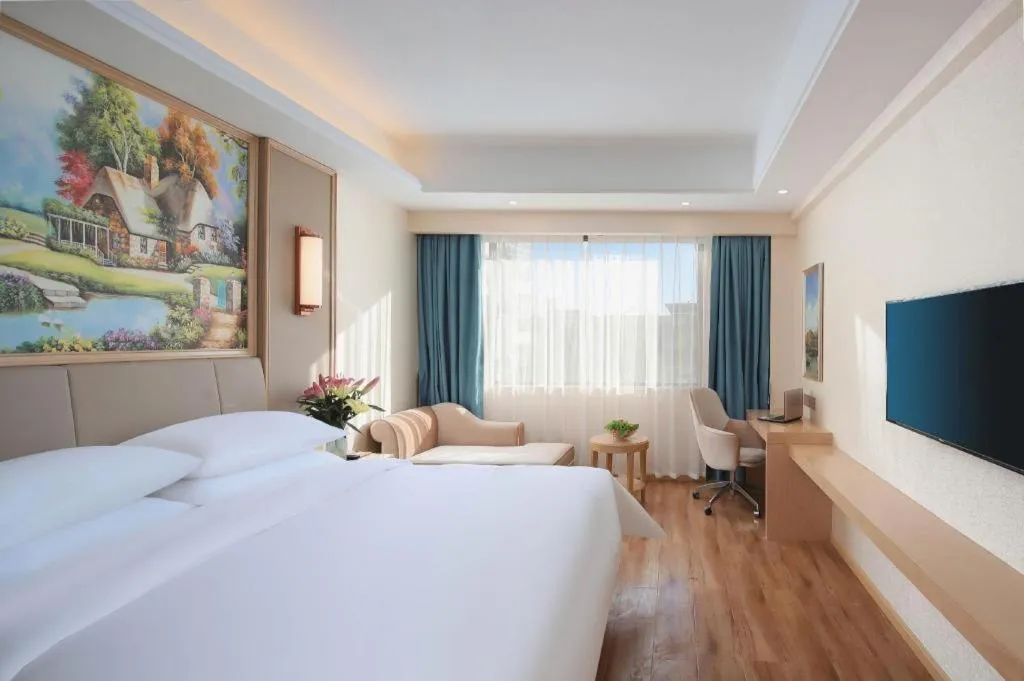 Bed in Vienna Hotel Kunming Baiyun Road Metro Station Jiang'an