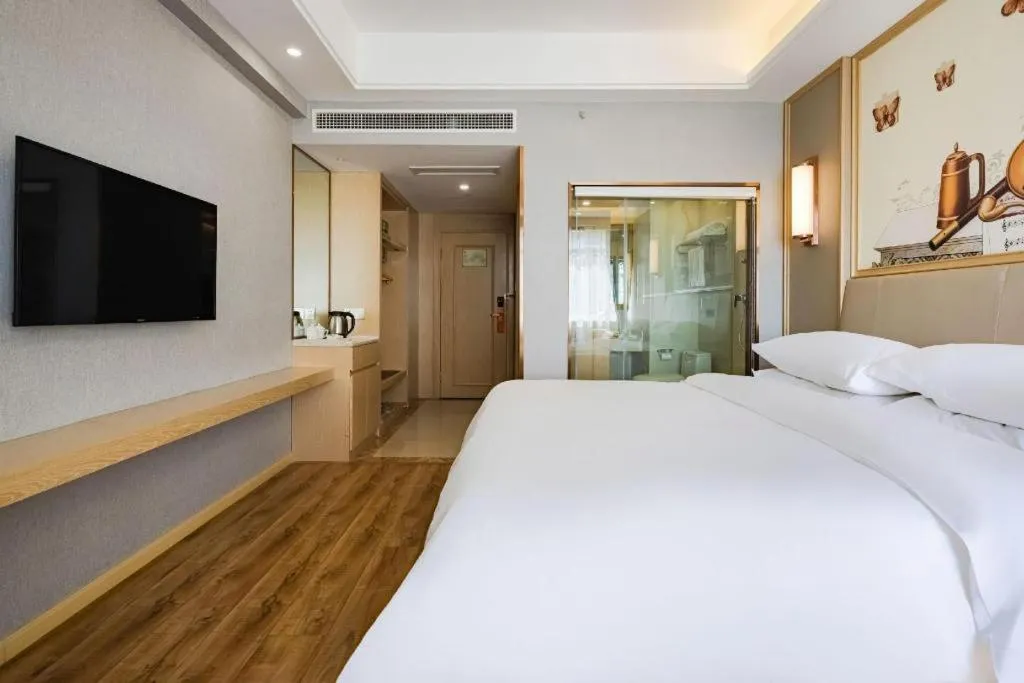 Bed in Vienna Hotel Kunming Baiyun Road Metro Station Jiang'an