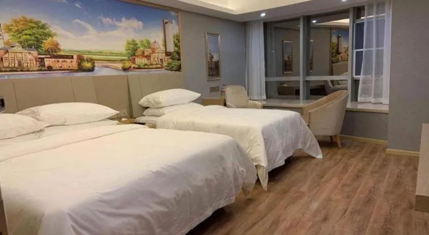 Bed in Vienna Hotel Kunming Baiyun Road Metro Station Jiang'an