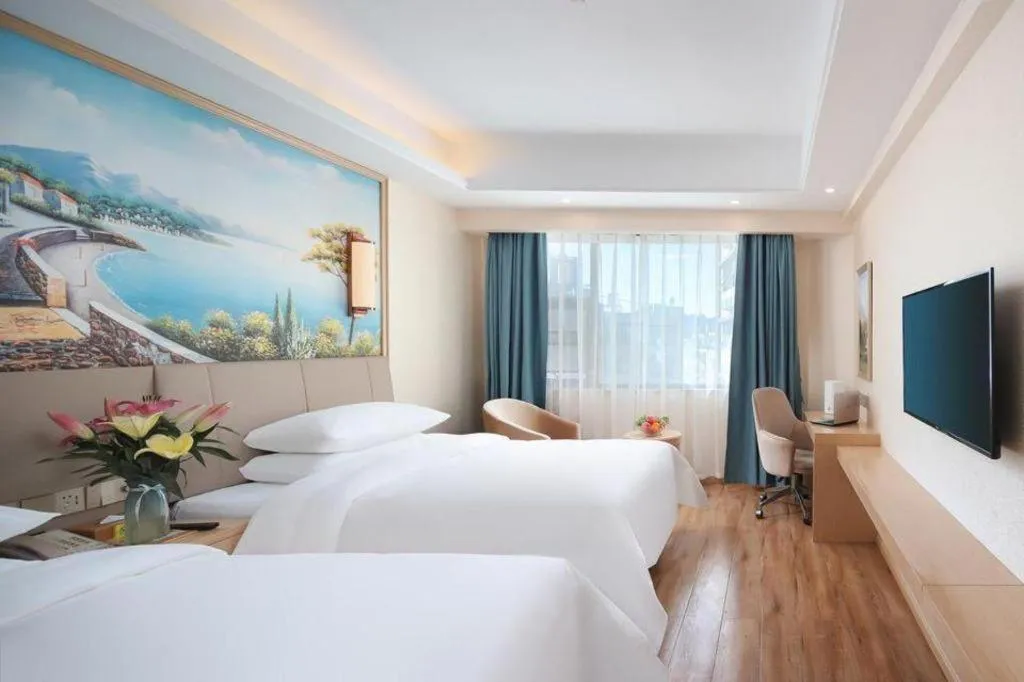 Bed in Vienna Hotel Kunming Baiyun Road Metro Station Jiang'an