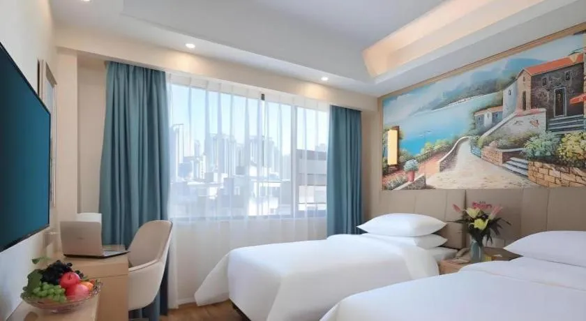 Bed in Vienna Hotel Kunming Baiyun Road Metro Station Jiang'an