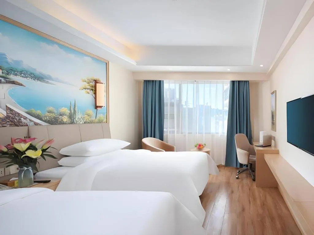 Bed in Vienna Hotel Kunming Baiyun Road Metro Station Jiang'an