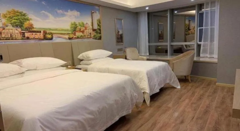 Bed in Vienna Hotel Kunming Baiyun Road Metro Station Jiang'an