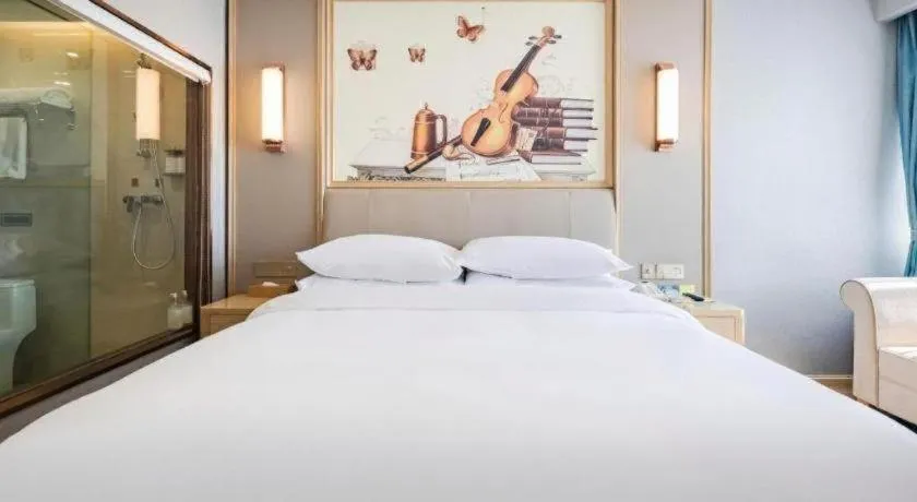 Bed in Vienna Hotel Kunming Baiyun Road Metro Station Jiang'an