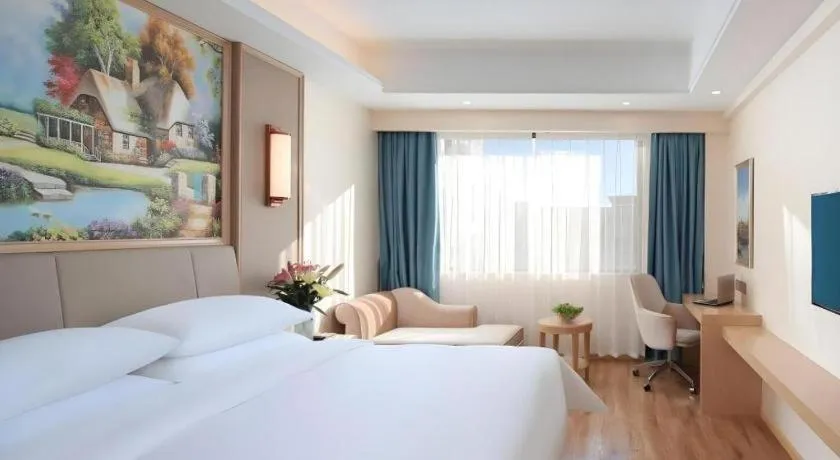 Bed in Vienna Hotel Kunming Baiyun Road Metro Station Jiang'an