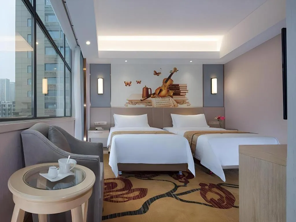 Bed in Vienna Hotel Chongqing Shiqiaopu Metro Station